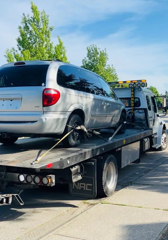 Full Time Towing flatbed loading an unwanted vehicle in Surrey